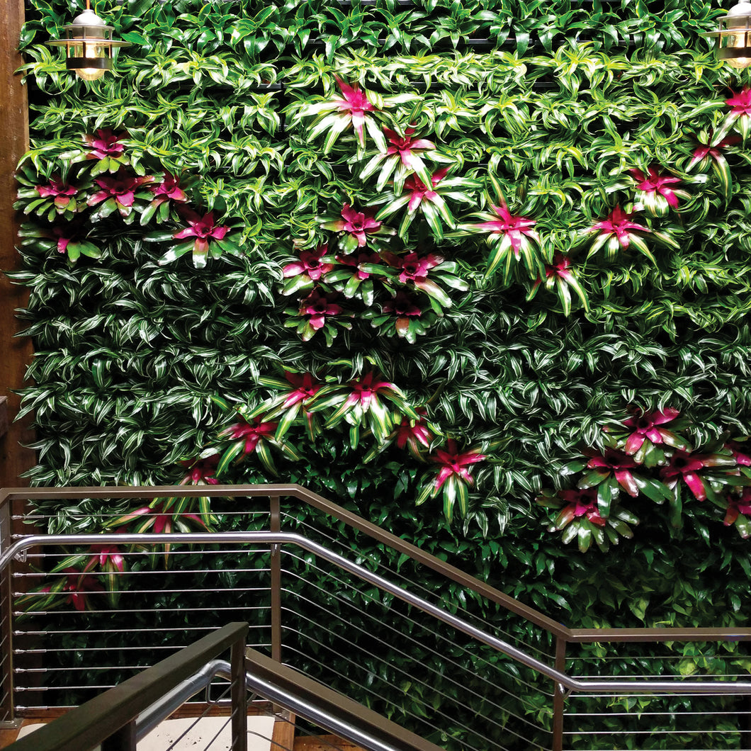 Enliven a stairway with a vertical green plant wall.